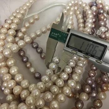 NEMOKAMAS PRISTATYMAS, 16 COLIŲ 10-14 mm pobūdžio gėlavandenių perlų medžiaga su apvalios formos-balta ir violetinė sumaišyti perlai